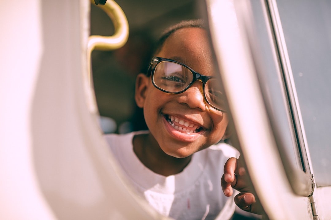 boy taking picture on window LhOjrOlcLx4 jpg