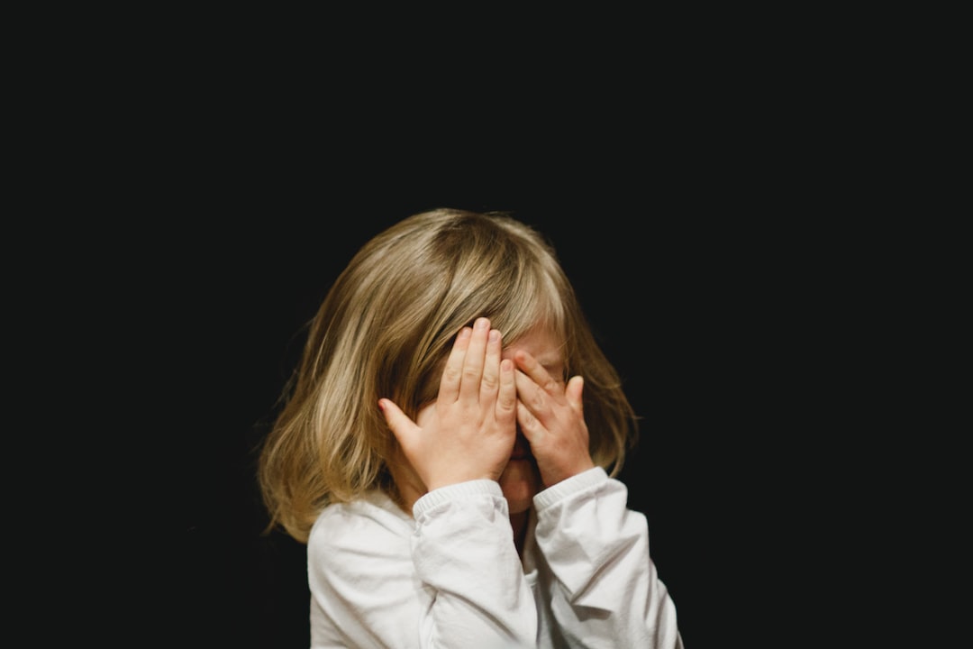 girl covering her face with both hands VZILDYoqn U jpg