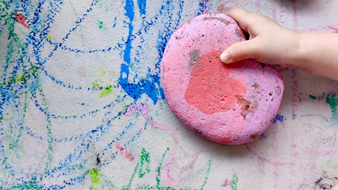 person holding pink and blue paint yRIu cvqbas jpg