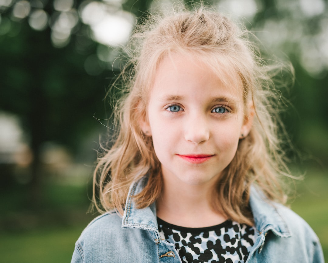 smiling girl in blue denim jacket IVrtlceLSzs jpg